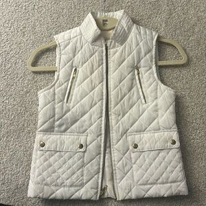 Girls size 78 puffer vest. Copper key with gold zippers and buttons.